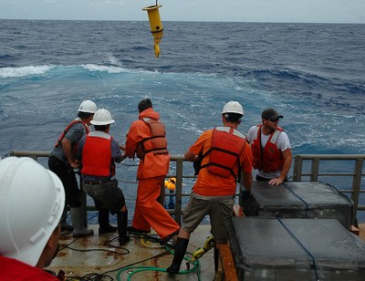 Penn State researchers Raymond Najjar (2nd from left) and Douglas Martins (4th from left) retrieve a drifter from the Atlantic Ocean with the help of the  ship&#8217;s crew. Image: Bettina Sohst/Old Dominion University.